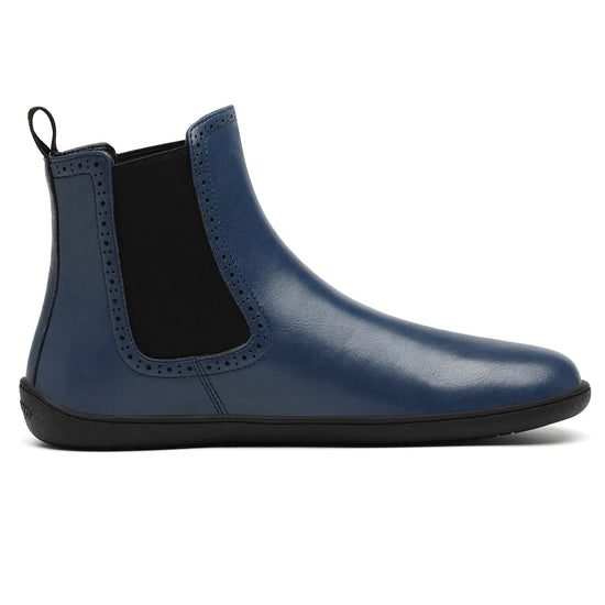Calzado barefoot formal con elásticos laterales y suela plana zero drop para una postura natural.