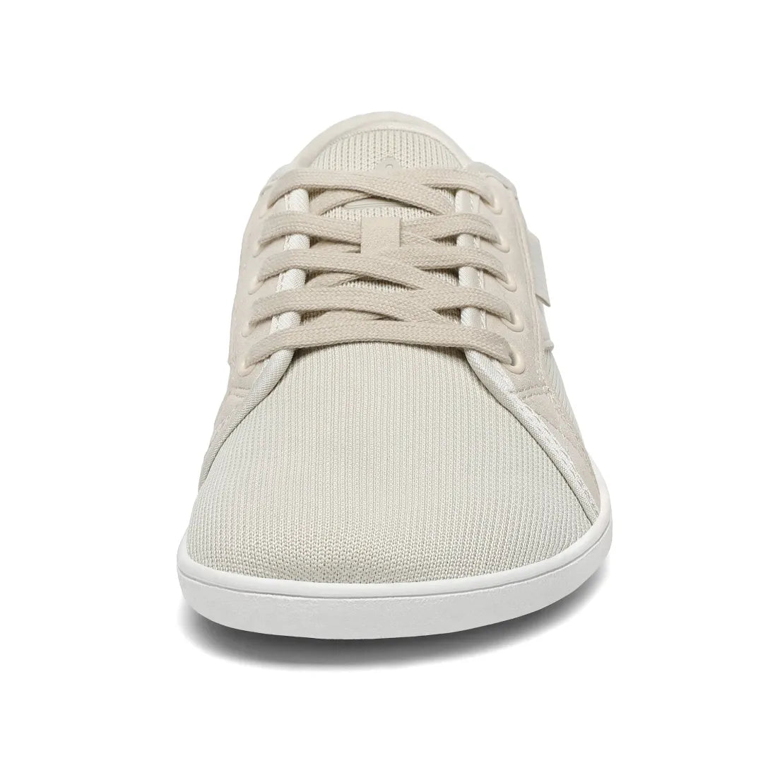 Zapatilla barefoot urbana frontal color crema, suela delgada.