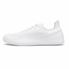 Perfil zapatilla deportiva minimalista blanca, suela plana.