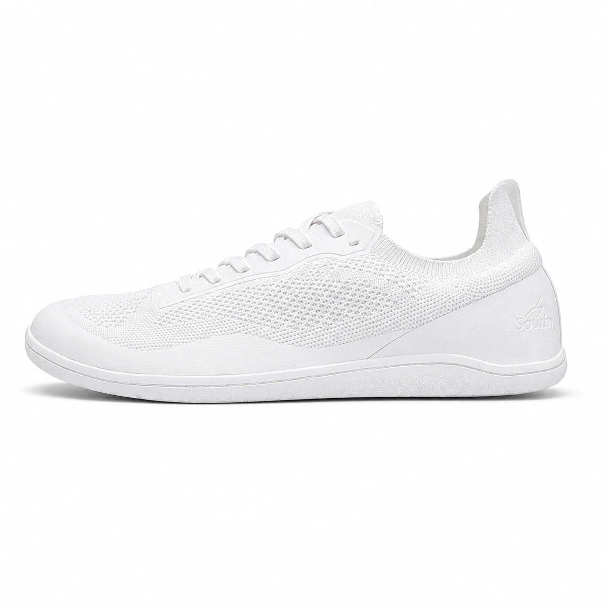 Perfil zapatilla deportiva minimalista blanca, suela plana.