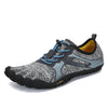 Zapatilla barefoot Saguaro Fast I gris vista diagonal mostrando diseño deportivo minimalista.
