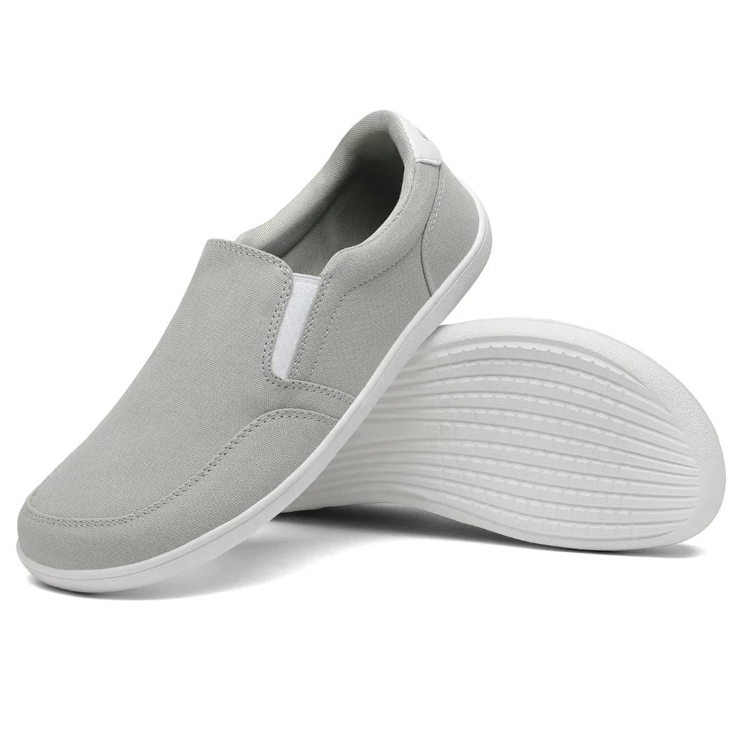 Suela plana gris/blanca para caminar natural y postura correcta.