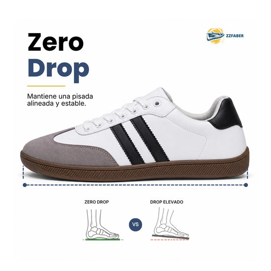 Perfil lateral de zapatillas minimalistas blancas urbanas ZZFABER Niza 2.0 con suela plana drop cero, ideal para evitar dolores por juanetes.